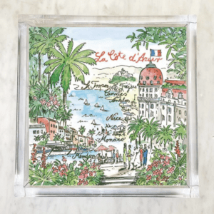 La Cote d'Azur luncheon napkins featuring a colorful French Riviera design with palm trees, yachts, and scenic views