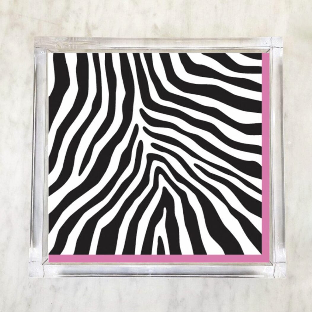 Zebra black and white luncheon paper napkins with a thin pink border, perfect for adding a fun and elegant touch to any dining occasion