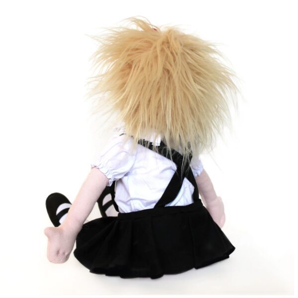 The back of Eloise at the Plaza soft doll with messy blonde hair, wearing a black skirt, white blouse, and suspenders sitting