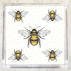 Paper napkin featuring a pattern of detailed black and yellow bees with transparent wings on a white background with yellow polka dots