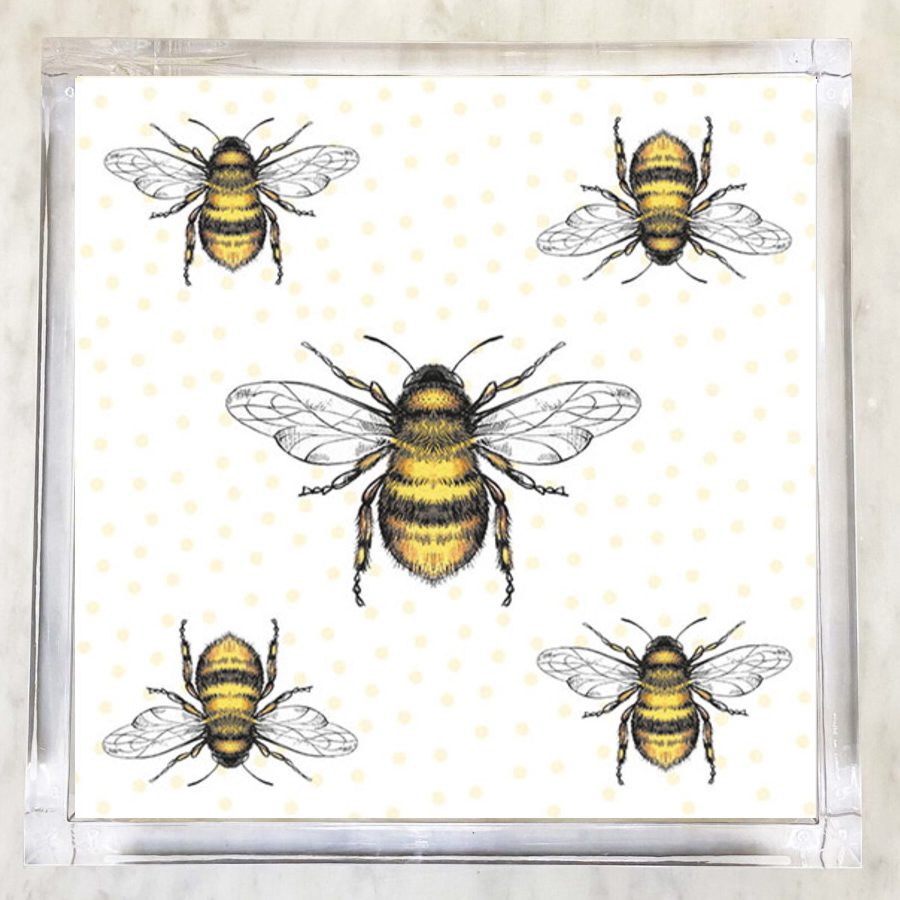 Paper napkin featuring a pattern of detailed black and yellow bees with transparent wings on a white background with yellow polka dots