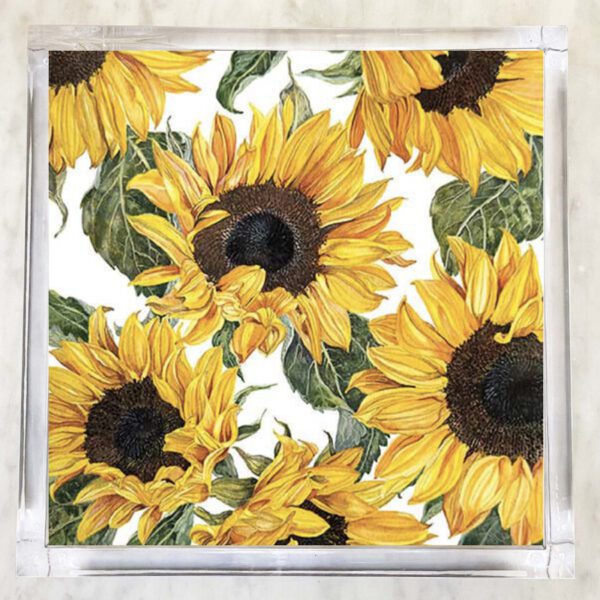 Paper napkin featuring a vibrant design of large blooming sunflowers with green leaves on a white background