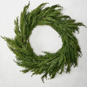 Lifelike cedar wreath with faux cedar branches and natural twig base for elegant seasonal décor